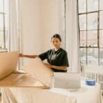 Ecommerce Website Design Malta: A Pre-Launch Checklist 4 Small business owner preparing products for online orders
