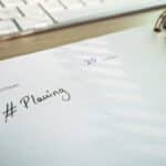 Planner and keyboard used to organise a website development timeline
