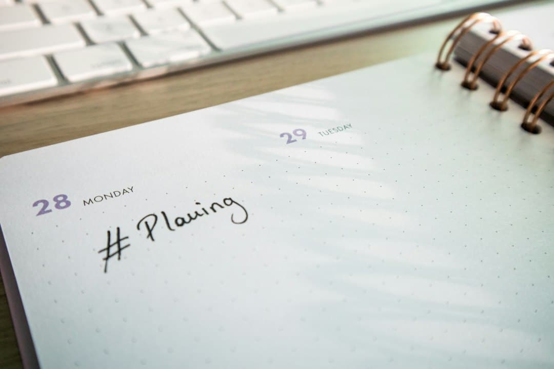 Planner and keyboard used to organise a website development timeline