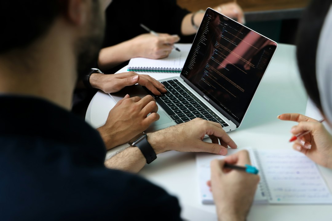 Business team reviewing an AI automation provider proposal around a laptop