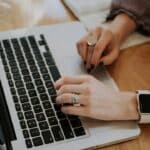 Writer planning an SEO content brief at a laptop
