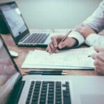 Website Content Checklist for Malta Businesses: What to Prepare Before Design Starts 4 Team reviewing website content and planning documents around a table