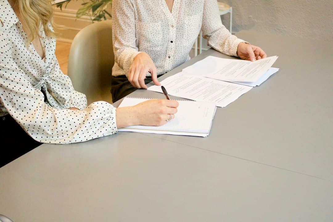 Digital Consulting Pros - Digital Marketing Agency Malta 11 Business representatives reviewing and signing a website development contract