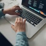 Website tester reviewing a site on a laptop before launch