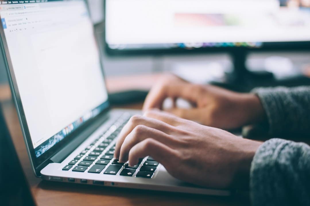 Digital Consulting Pros - Digital Marketing Agency Malta 19 Developer maintaining and monitoring a business website on a laptop
